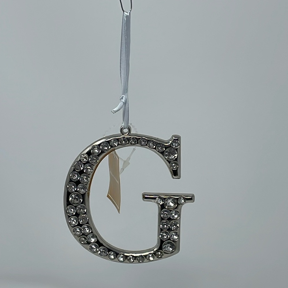 BNWT! Heavy metal “G” monogram ornament with rhinestone details.